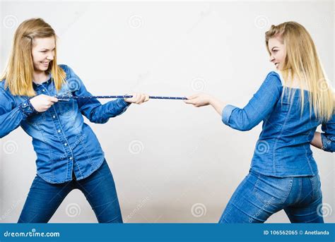 2 girls pulling a rope|Girl Pulling Rope Stock Photos, Images & Pictures